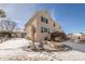 Exterior of home featuring a spacious backyard and patio with covered furniture at 445 Brendon Ct, Castle Pines, CO 80108