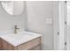 Bright bathroom with a wood vanity, modern fixtures, and a neutral color scheme at 445 Brendon Ct, Castle Pines, CO 80108