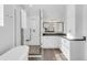 Luxurious bathroom featuring a glass-enclosed shower, soaking tub, and modern vanity with elegant countertops at 445 Brendon Ct, Castle Pines, CO 80108