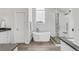 Modern bathroom featuring a soaking tub, glass-enclosed shower, and elegant finishes at 445 Brendon Ct, Castle Pines, CO 80108