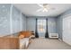 Charming Bedroom with a crib, soft blue walls, and decorative tree mural at 445 Brendon Ct, Castle Pines, CO 80108