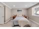 Neutral bedroom with carpet, soft bedding, and a side table on each side of the bed at 445 Brendon Ct, Castle Pines, CO 80108