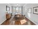 Elegant dining room with hardwood floors, a bay window, and a stylish chandelier at 445 Brendon Ct, Castle Pines, CO 80108