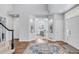 Inviting foyer with hardwood floors and an open layout leading into a bright and spacious living area at 445 Brendon Ct, Castle Pines, CO 80108