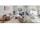 Bright and airy living room featuring large windows, neutral colors, and comfortable seating at 445 Brendon Ct, Castle Pines, CO 80108
