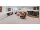 Spacious living room features a comfortable sectional sofa, bar, and a large TV at 445 Brendon Ct, Castle Pines, CO 80108