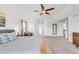 Spacious primary bedroom with a ceiling fan, ensuite bathroom and neutral carpet at 445 Brendon Ct, Castle Pines, CO 80108