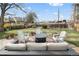 Seating around a firepit in a well maintained backyard at 537 S Grape St, Denver, CO 80246
