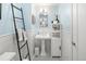 Stylish bathroom with black and white tile flooring and modern fixtures at 537 S Grape St, Denver, CO 80246