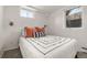 Cozy bedroom featuring light walls, plush bedding, and natural light at 537 S Grape St, Denver, CO 80246