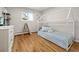 bedroom featuring a tent bed frame, hardwood floors, and bright natural light at 537 S Grape St, Denver, CO 80246