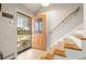 Inviting entryway with a decorative security door, stairs to the second floor, and natural light at 537 S Grape St, Denver, CO 80246