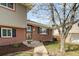 Charming home exterior showcasing brick facade and manicured front lawn at 537 S Grape St, Denver, CO 80246