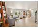 Bright living room features hardwood floors, a large window, and stylish furnishings, creating a warm and inviting atmosphere at 537 S Grape St, Denver, CO 80246