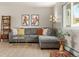 Comfortable living room with a sectional sofa, stylish decor, and natural light from a large window at 537 S Grape St, Denver, CO 80246