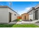 Backyard features small wooden sauna, patio, and manicured grass, offering privacy and outdoor enjoyment at 4752 Eliot St, Denver, CO 80211