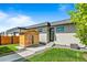 Well-maintained backyard with small wooden sauna, concrete patio, and manicured lawn, perfect for relaxation at 4752 Eliot St, Denver, CO 80211