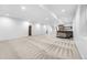 Expansive finished basement with carpeted floors, recessed lighting, and a wet bar, ready for entertaining at 4752 Eliot St, Denver, CO 80211
