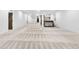 Large finished basement area featuring carpeted floors, a wet bar and ample space for activities at 4752 Eliot St, Denver, CO 80211