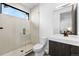 Modern bathroom featuring a glass shower, stylish tile, and vanity at 4752 Eliot St, Denver, CO 80211