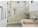 Modern bathroom featuring a frameless glass shower, freestanding tub, and contemporary fixtures at 4752 Eliot St, Denver, CO 80211