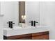Sleek bathroom with modern double vanity, designer faucets, and ample counter space at 4752 Eliot St, Denver, CO 80211