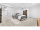This spacious bedroom is furnished with a queen bed and side table at 4752 Eliot St, Denver, CO 80211