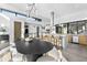 Open concept dining area with modern lighting and a spacious layout perfect for entertaining at 4752 Eliot St, Denver, CO 80211