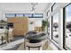 Bright dining area with large windows, contemporary lighting, and seating for six at 4752 Eliot St, Denver, CO 80211