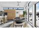 Contemporary dining area with large windows, stylish lighting, and views of the snowy outdoors at 4752 Eliot St, Denver, CO 80211