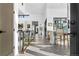 Hallway with views of the open living space and kitchen island with barstool seating at 4752 Eliot St, Denver, CO 80211