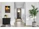 Bright hallway with sleek floors, accent art, and modern decor, creating a welcoming space at 4752 Eliot St, Denver, CO 80211