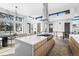 Bright, open kitchen with a large island, stainless steel hood, and modern lighting at 4752 Eliot St, Denver, CO 80211