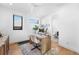 Bright home office with wood floors, modern desk, and natural light creating an inspiring workspace at 4752 Eliot St, Denver, CO 80211