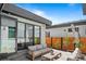 Stylish outdoor patio with comfortable seating and privacy fence providing perfect outdoor relaxation at 4752 Eliot St, Denver, CO 80211