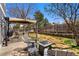 Backyard patio area with outdoor seating, grill, and a manicured lawn at 17018 Carr Ave, Parker, CO 80134