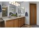 Bright bathroom boasts double vanity, neutral counter tops, and updated lighting fixtures at 17018 Carr Ave, Parker, CO 80134