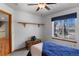Comfortable bedroom with a window view and ample natural light at 17018 Carr Ave, Parker, CO 80134