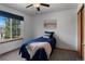 Cozy bedroom with a large window and a blue accent at 17018 Carr Ave, Parker, CO 80134