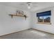 Bright bedroom featuring a large window with natural light and neutral decor at 17018 Carr Ave, Parker, CO 80134