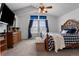 A comfy bedroom featuring a vaulted ceiling, ceiling fan, dresser and large window at 17018 Carr Ave, Parker, CO 80134