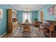 Elegant dining room features a wooden table set, hardwood floors, and lots of natural light at 17018 Carr Ave, Parker, CO 80134