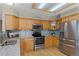 Modern kitchen features stainless steel appliances, granite countertops, and tile backsplash at 17018 Carr Ave, Parker, CO 80134