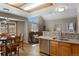 Open kitchen featuring granite counters, oak cabinets, stainless appliances, and breakfast nook at 17018 Carr Ave, Parker, CO 80134