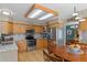 Well-lit kitchen with stainless steel appliances, granite counters, and a view to the dining area at 17018 Carr Ave, Parker, CO 80134