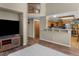Open-concept living room connects to a bright kitchen and dining area at 17018 Carr Ave, Parker, CO 80134