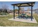 Neighborhood playground with shade and picnic tables for community members to enjoy at 17018 Carr Ave, Parker, CO 80134