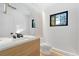 Modern bathroom with a sleek vanity, designer mirror, and contemporary fixtures at 715 Glencoe St, Denver, CO 80220