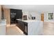 Contemporary kitchen showcasing a large island, stainless steel appliances, modern cabinets, and an open layout at 715 Glencoe St, Denver, CO 80220