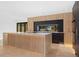 A modern kitchen island featuring marble countertops, stainless steel appliances, and built-in features at 715 Glencoe St, Denver, CO 80220